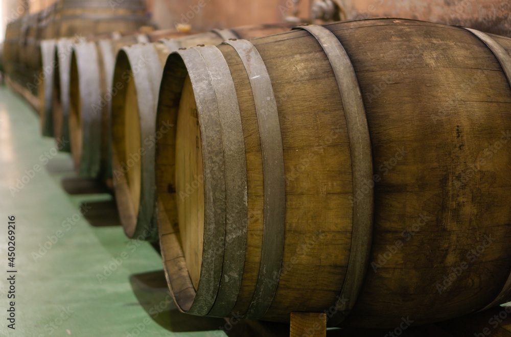 old wooden wine barrels in a wine press old wooden wine barrels in a wine press