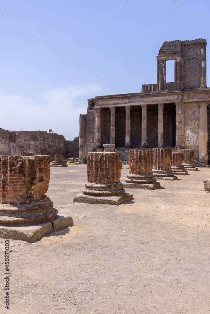 Fototapeta premium Ruins of an ancient city destroyed by the eruption of the volcano Vesuvius, forum with Basilica, Pompeii, Naples, Italy