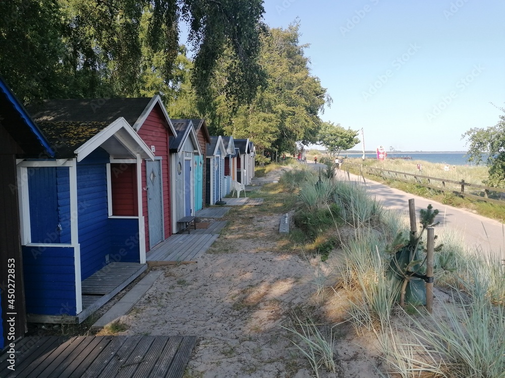 Cute colorful small beach huts and houses in Southern Sweden, Ystad