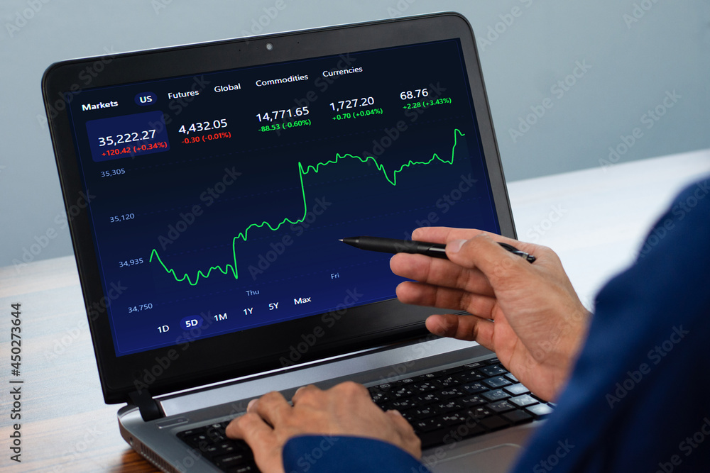 Man point on screen digital chart trading online at home Man point on screen digital chart trading online at home