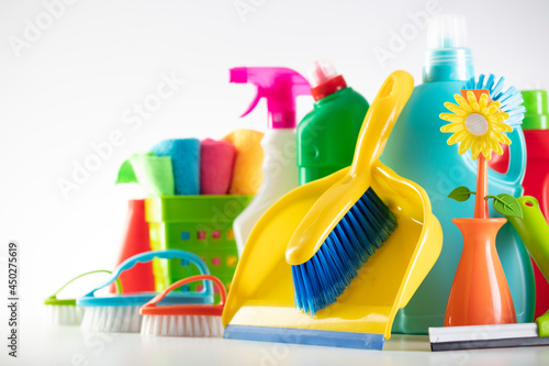 
Summer cleaning. Colorful set of bottles with clining liquids and colorful cleaning kit on white background.

