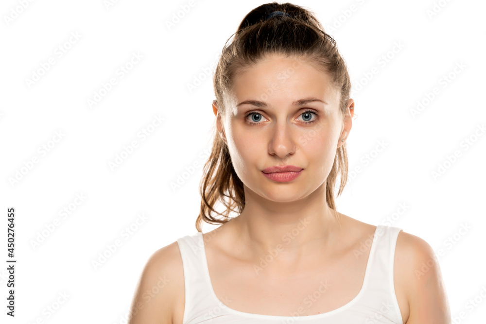 portrait of a serious woman with blue eyes and no makeup portrait of a serious woman with blue eyes and no makeup