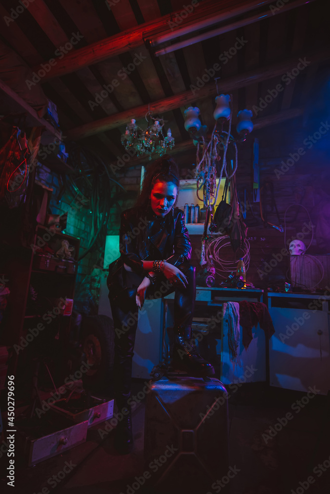 Cyberpunk girl in a post-apocalyptic futuristic style in a garage Cyberpunk girl in a post-apocalyptic futuristic style in a garage
