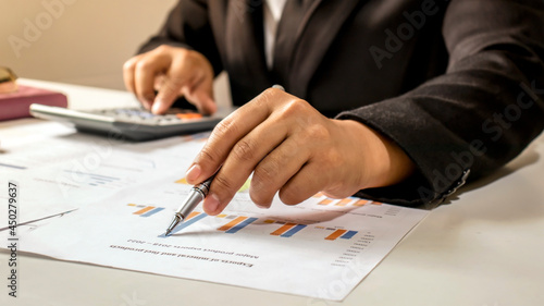 Businessman checking financial reports at work concept of office work and success at work