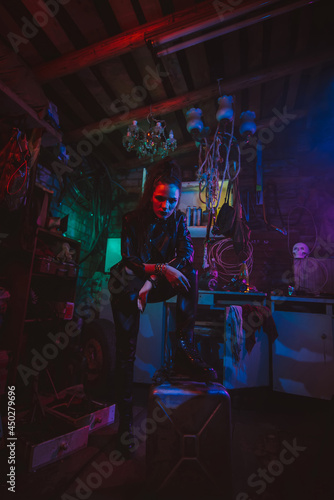 Cyberpunk girl in a post-apocalyptic futuristic style in a garage