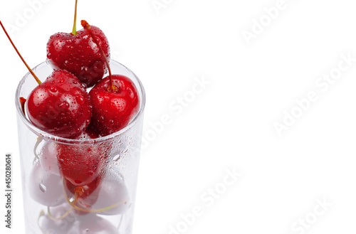 Wallpaper Mural cherries in a glass on white background, copy space Torontodigital.ca