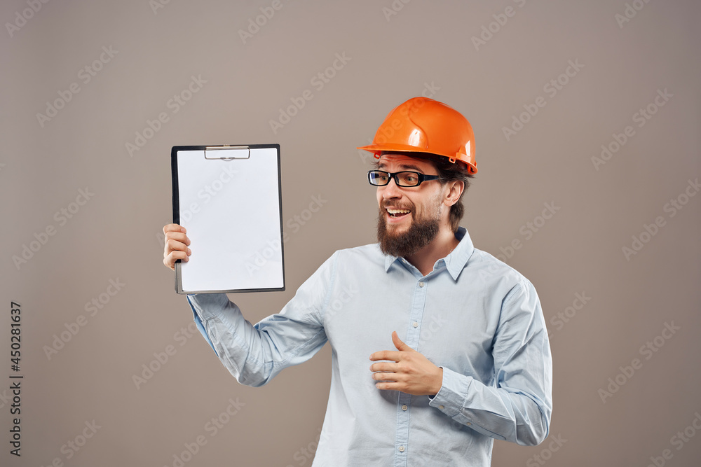 bearded man orange helmet on the head Studio hand gesture bearded man orange helmet on the head Studio hand gesture