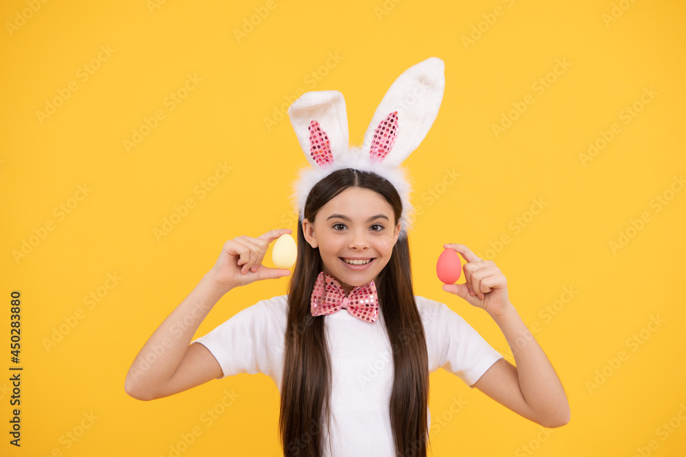 happy easter teen girl in bunny ears and bow tie hold painted eggs, easter egg
