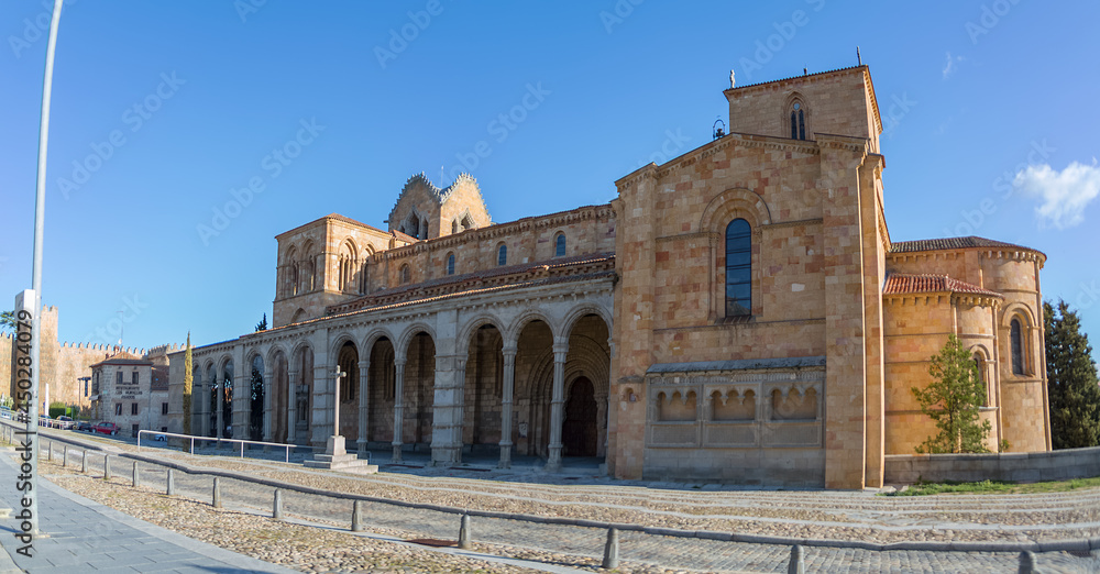 Full view of San Vicente Cathedral, Basílica de San Vicente, Ávila medieval historic fortress as background Full view of San Vicente Cathedral, Basílica de San Vicente, Ávila medieval historic fortress as background