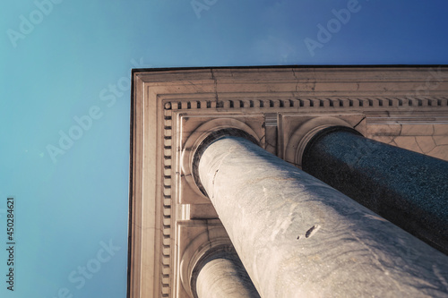 Close bottom view of aged antique columns in classic vintage style