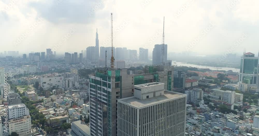 Aerial view of rooftop construction site on a high building at the center business district 1 in Ho Chi Minh City in 2020 Aerial view of rooftop construction site on a high building at the center business district 1 in Ho Chi Minh City in 2020