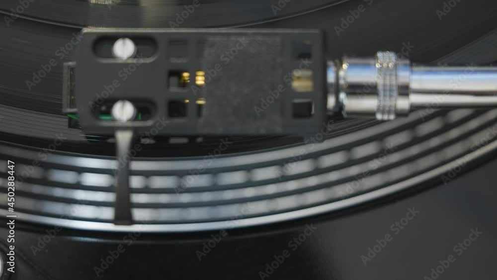 Top view of the black turntable for music with the spinning disc on it in Estonia Top view of the black turntable for music with the spinning disc on it in Estonia