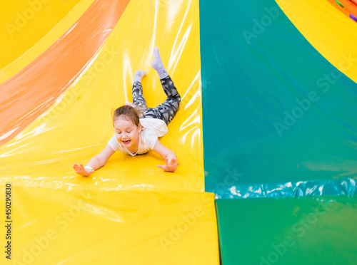 Child plays fun in the entertainment center. Game center