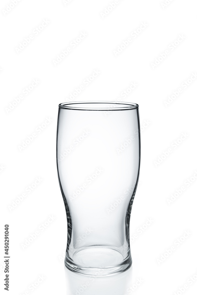 empty glass isolated on white. An empty glass on a white background. empty glass isolated on white. An empty glass on a white background.