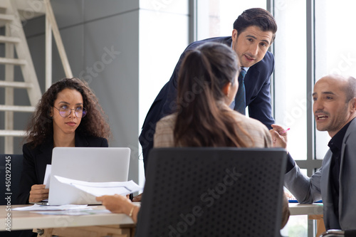 Business meeting. buiness team brainstorming. Diverse team of business people  cooperating on developing common design project photo