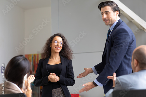 Businss man team leader introducing new employee to colleagues in office