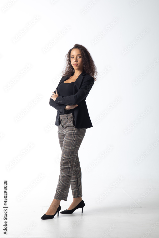 Portrait of a beautiful young hispanic woman smiling afro hairstyle isolated on white background Portrait of a beautiful young hispanic woman smiling afro hairstyle isolated on white background