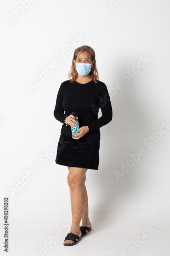 Seinor Asian woman model wearing protective face mask standing isolated on white background. photo