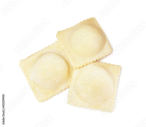 Uncooked ravioli with filling on white background, top view