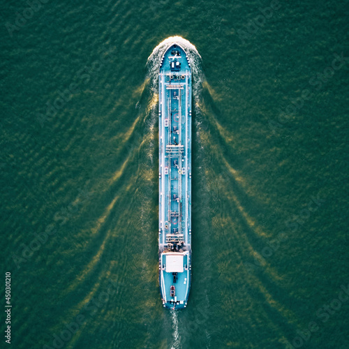 Leinwand Poster Tankship industrial gas carrier seen from a drone view.