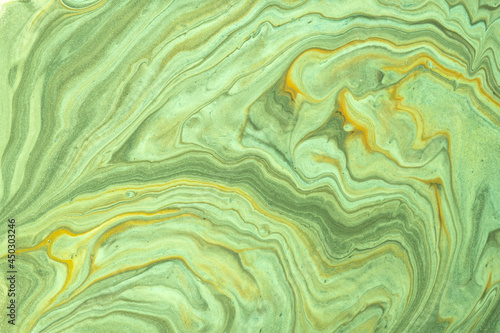 Abstract fluid art background light green and olive colors. Liquid marble. Acrylic painting with yellow gradient.