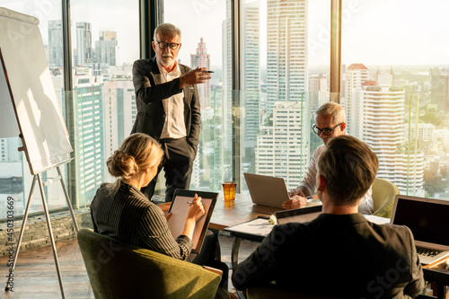 Group of business People Meeting  in office on window . marketing team Conference Brainstorming with senior executive manager.  Financial Teamwork discussing strategy at workspace of Corporate