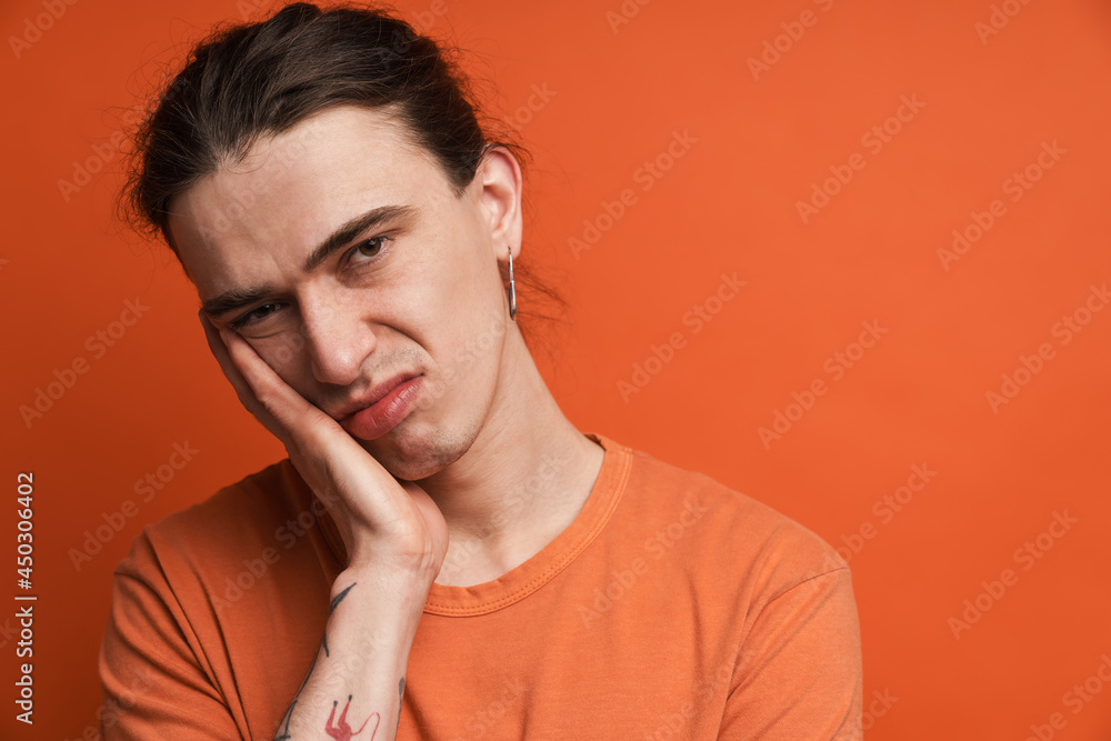 Portrait of a young white casual man with long brown hair Portrait of a young white casual man with long brown hair