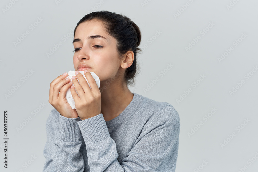 woman wipes her nose with a handkerchief runny nose health problems cold woman wipes her nose with a handkerchief runny nose health problems cold