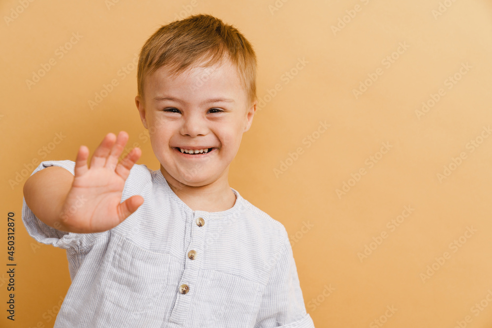White boy with down syndrome smiling and gesturing at camera - obrazy, fototapety, plakaty 