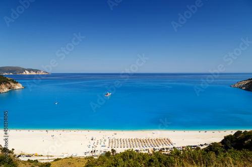 Fantastic panoramic top view at Myrtos Beach with turquoise and blue Ionian Sea water. Summer scenery of famous and extremely popular travel destination in Cephalonia, Greece, Europe. © Iryna Budanova