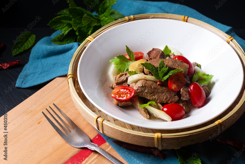 Φωτογραφία Food concept Thai spicy beef salad Yum Nua yang on wooden board with copy space