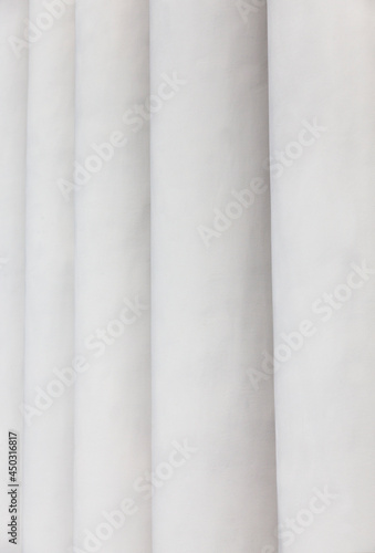 the columns of the building painted in white paint