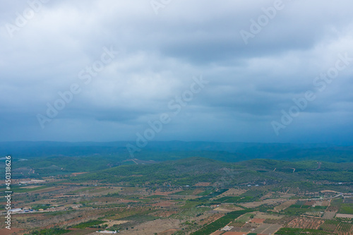 Spanish plains and hills from the Santa Llucia belvedere (Alcossebre-Alcala de Xivert, Spain). Beautiful view of magnificent nature. Cloudy day on the panoramic spot. photo