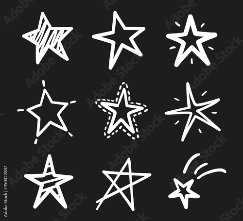 Hand drawn outline stars on isolated background. Freehand simple signs. Quick sketches. Black and white illustration