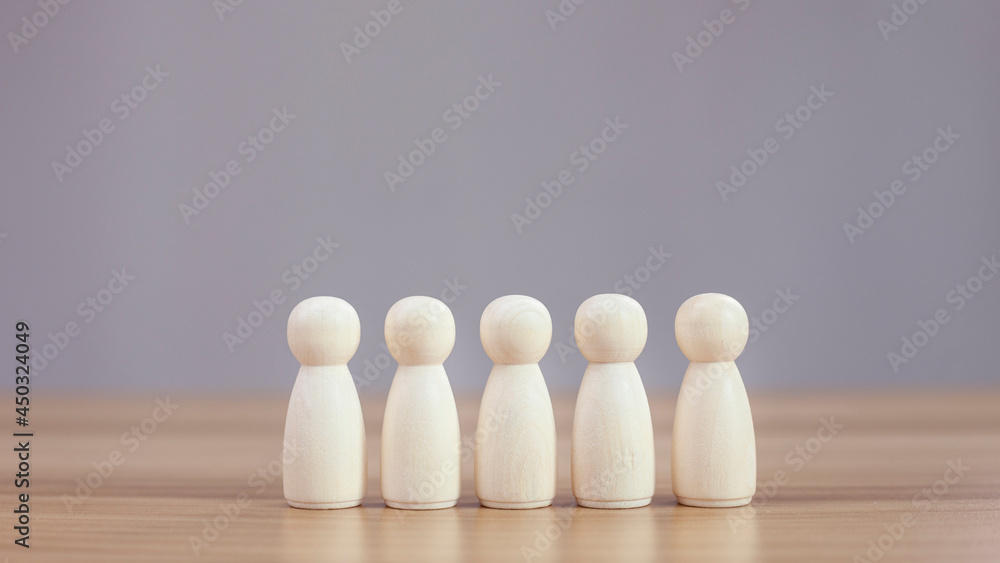 Close up wood person model icon on wooden table, copy space. Close up wood person model icon on wooden table, copy space.