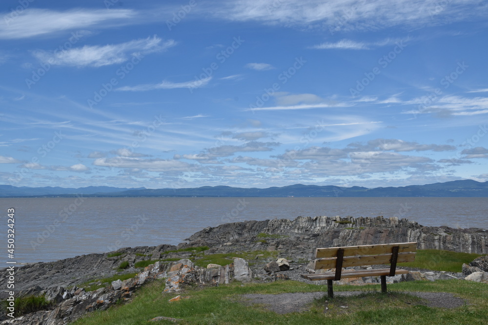 A bench along the St.Lawrence River. Québec, Canada A bench along the St.Lawrence River. Québec, Canada