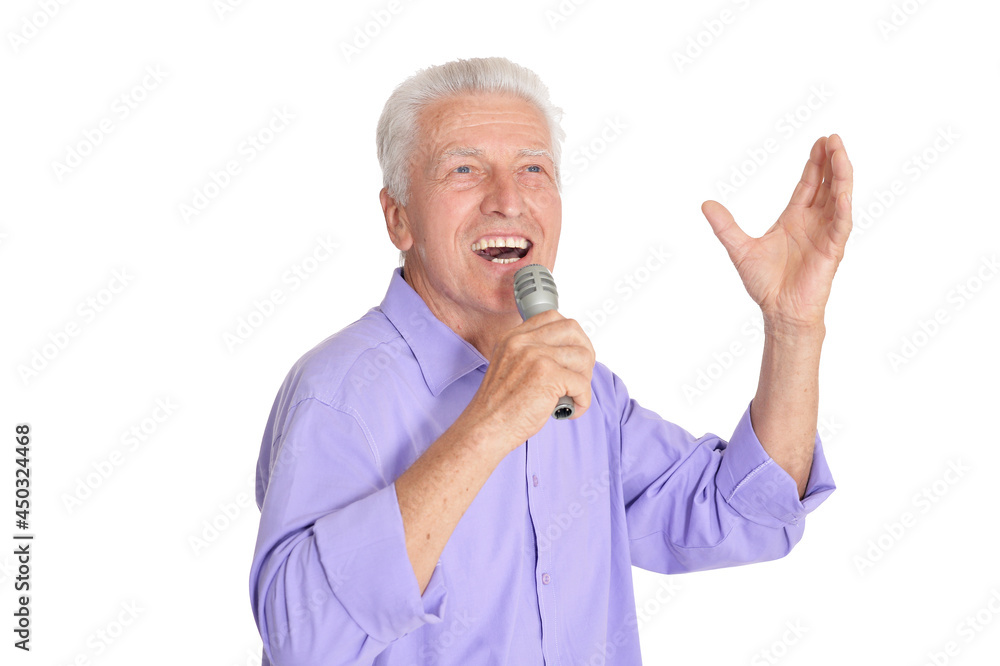 Portrait of senior mansinging with microphone isolated on white background Portrait of senior mansinging with microphone isolated on white background