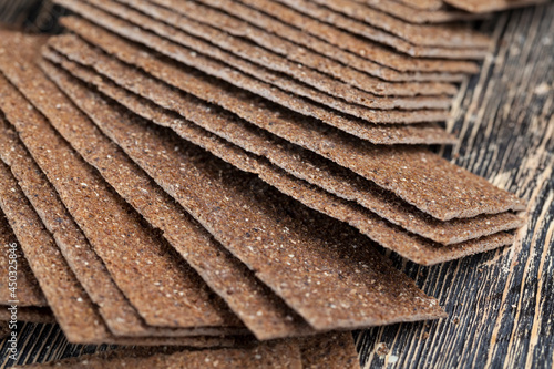 Fototapeta thin rye bread with coriander
