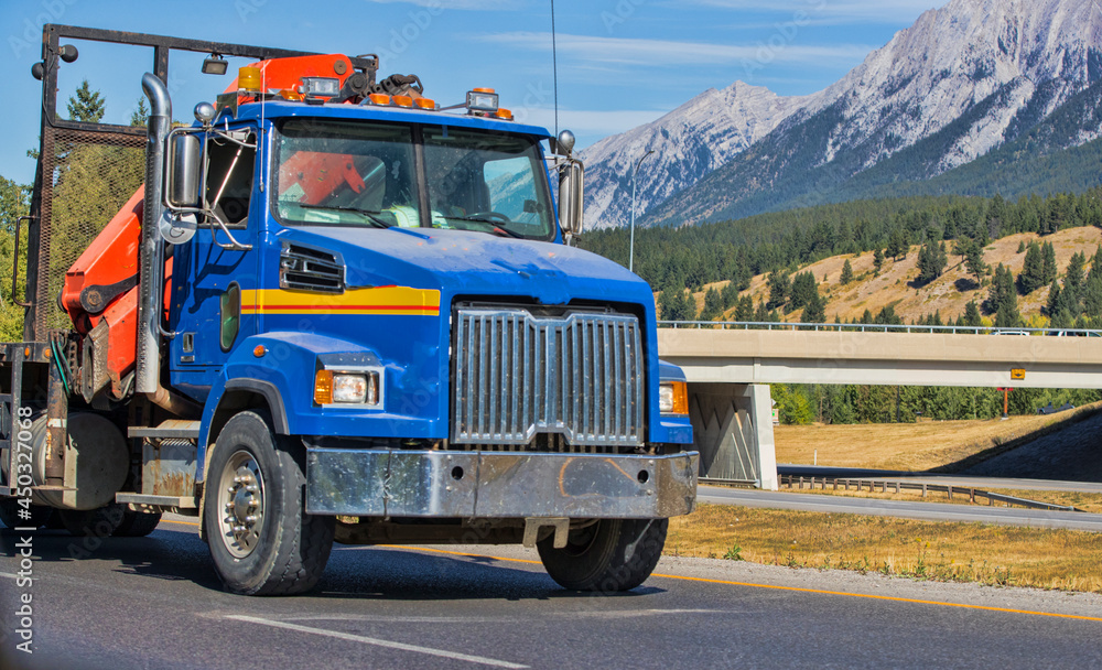 Heavy cargo on the road. A truck hauling freight along a highway Heavy cargo on the road. A truck hauling freight along a highway