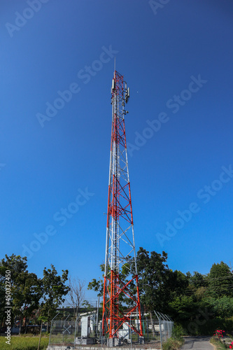  communication tower. Telco Trellis for 3G 4G 5G Apocalypse Internet Communication, mobile, FM Radio and Television Broadcasting On Air with Blue Sky in Background" 