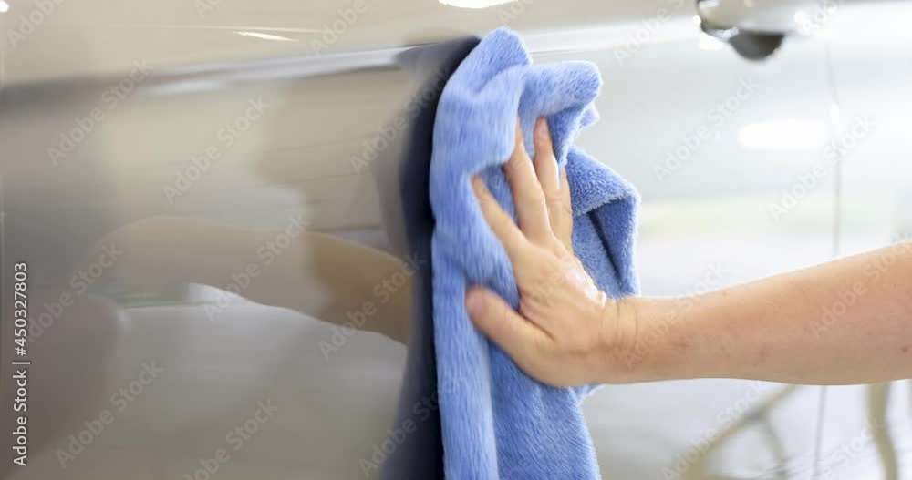 Man wiping car with microfiber cloth closeup 4k movie Man wiping car with microfiber cloth closeup 4k movie