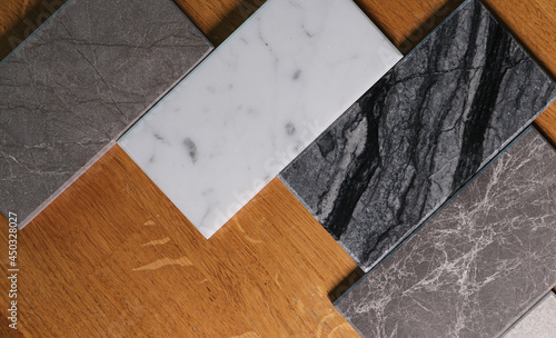 View of color samples marble  on oak wood table.