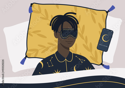 A young male Black character wearing a night mask and silk pajamas in bed, a mobile phone on silent mode next to them on a pillow
