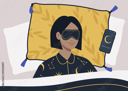 A young female character wearing a night mask and silk pajamas in bed, a mobile phone on silent mode next to them on a pillow