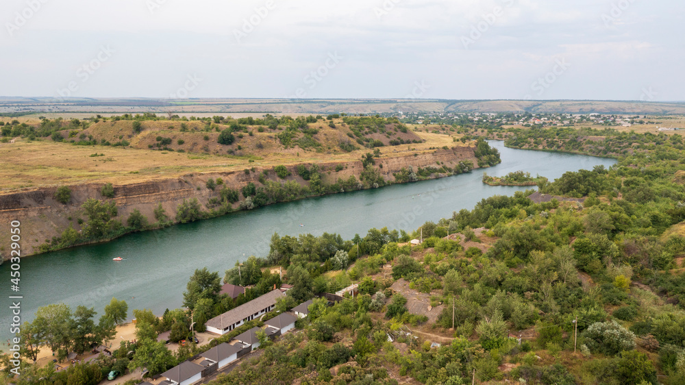 Quarry filled with water, artificial lake, recreation and swimming area, aerial view