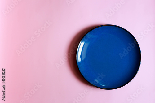 blue plate on pink background 