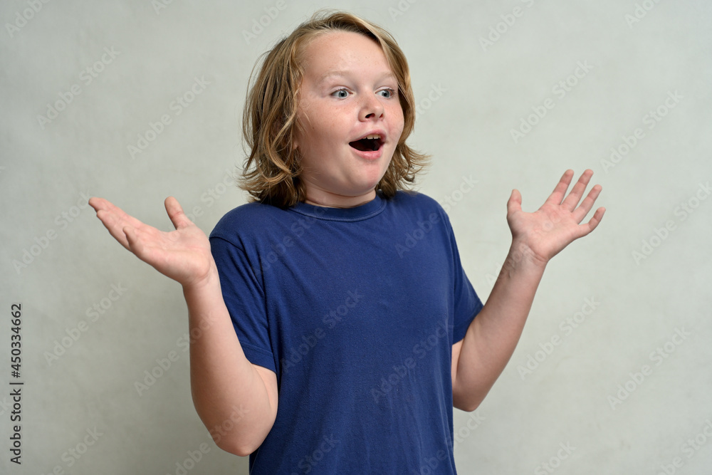 surprised cute caucasian teenager looking to the side over white background surprised cute caucasian teenager looking to the side over white background