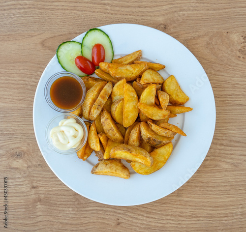 Potato wedges with dip and sauce
