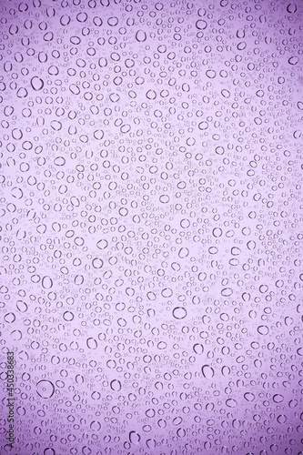 Purple glass have a water drops.