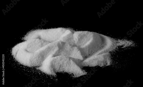 Sea salt crystals pile isolated on black background  side view with clipping path